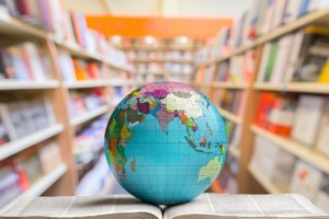 1611508966_book-and-globe-planet-on-library-background
